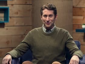 Adam Scott Wears a Red Oxford Shirt & Jeans
